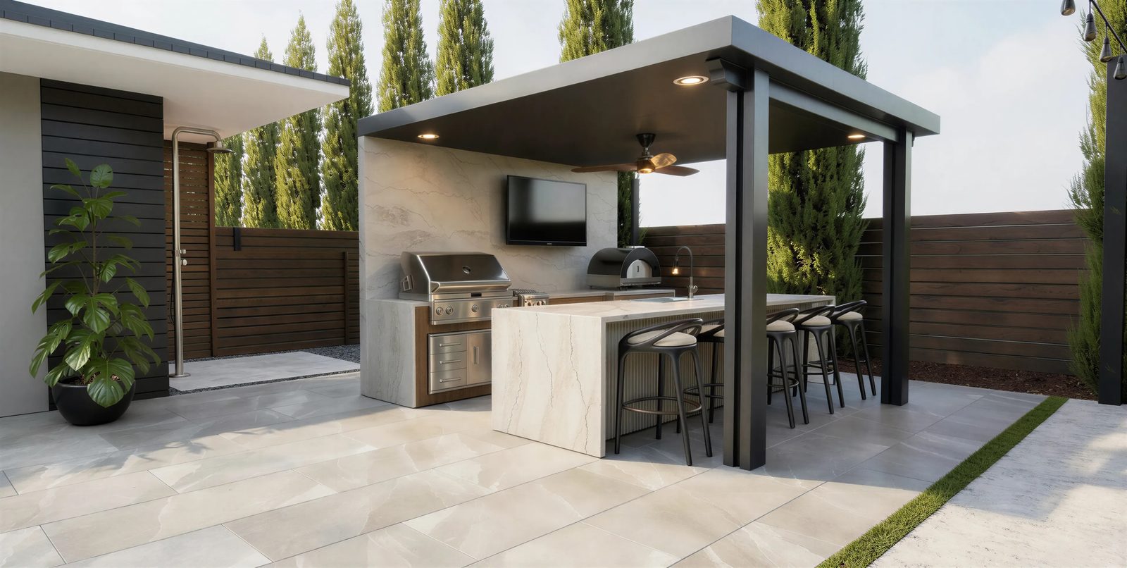 3D design rendering of an outdoor kitchen pavilion with a waterfall-edge island, built-in grill, pizza oven and bar seating for a Chula Vista backyard